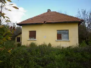 Old country house with plot of land located in small village