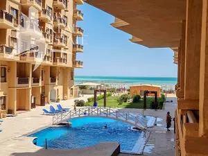 Sea and pool view studio for sale in a beachfront resort