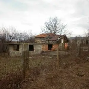 Rural property consisting of an uncompleted house,garage and a plot of land