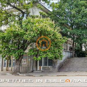 Spacious solid building with restaurant, shops and offices