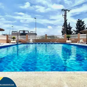 Second-floor bungalow with communal swimming pool