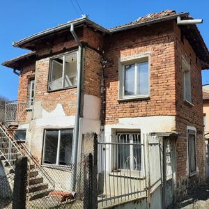 An old house with plot of land located up in the mountains