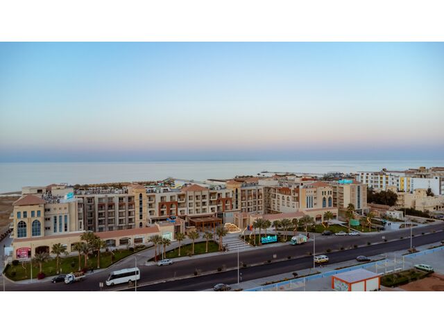 In front of SUNRISE Hotel